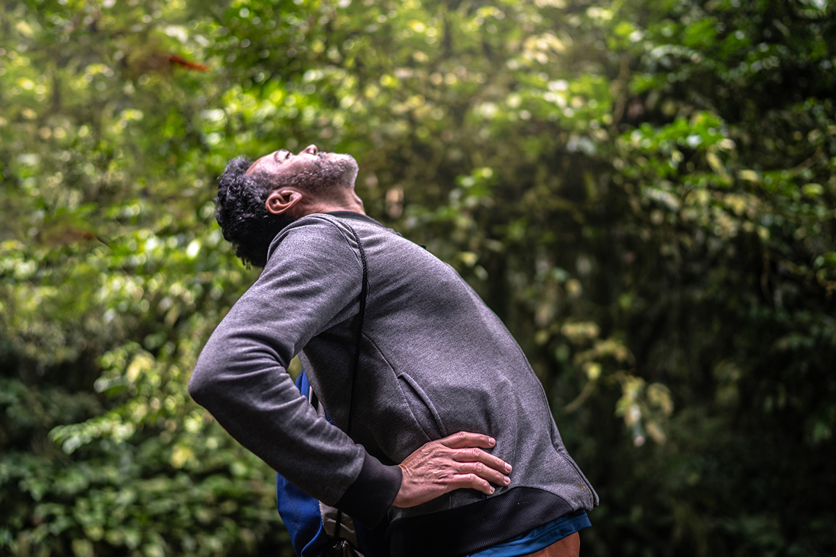 man before back pain treatment in Irving and Fort Worth